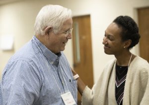 Alabama Arise member Lawton Higgs speaks with Gabrielle Daniels of the Equal Justice Initiative during Arise's 2019 annual meeting in Montgomery.